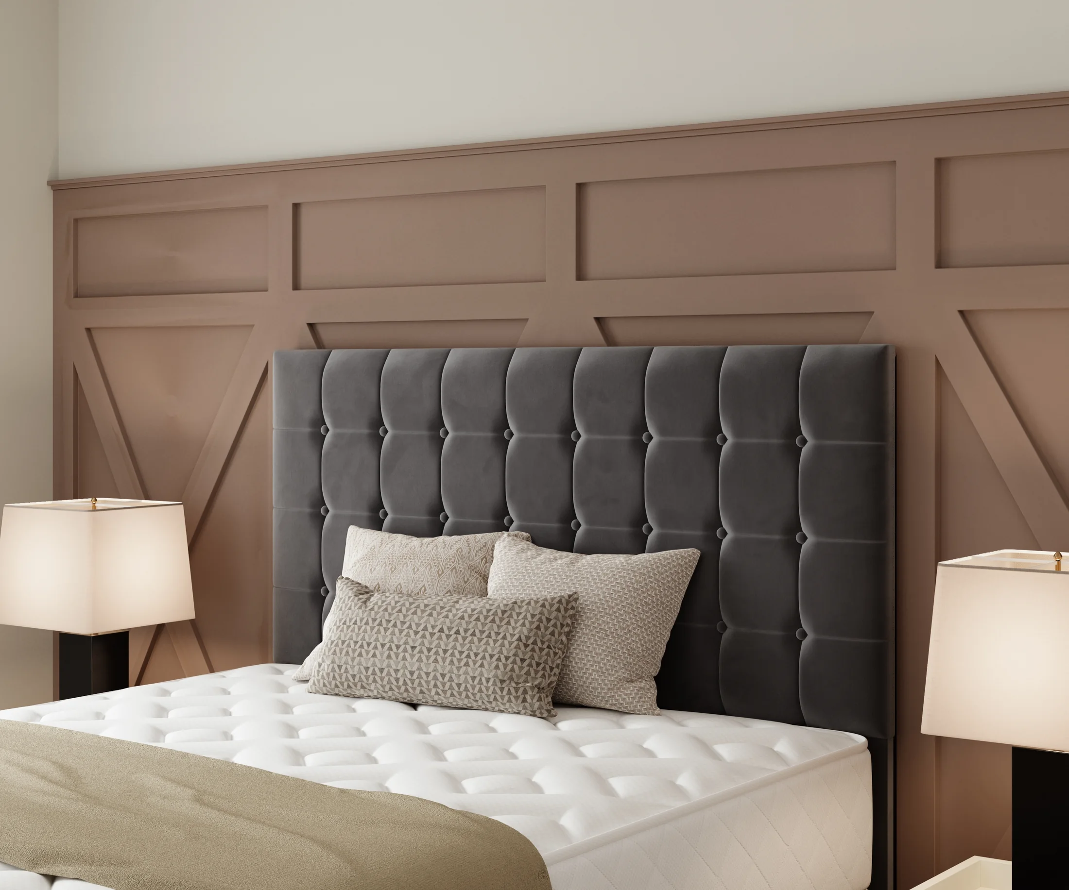 Close-up of grey tufted headboard and pillows